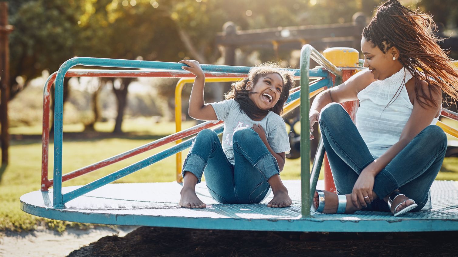 Mom and daughter play at the park